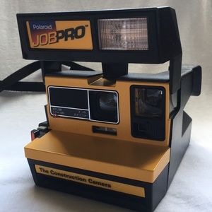 This is a yellow 1990s Polaroid JOBPRO film camera